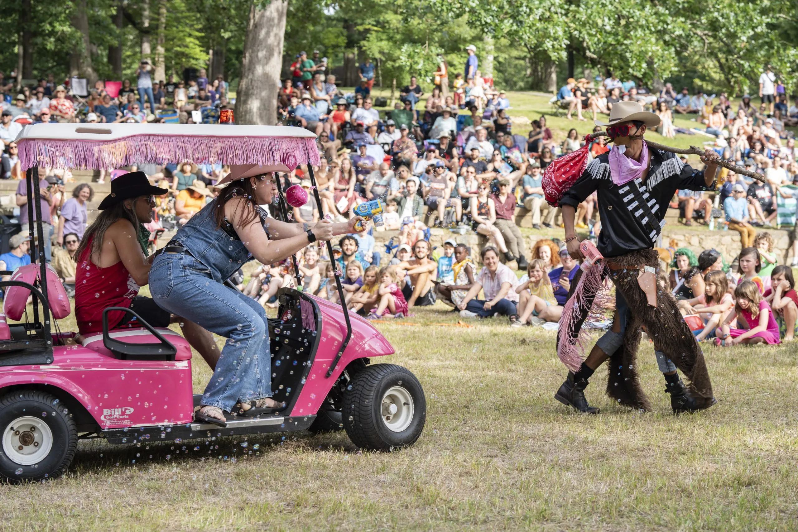 A golf cart chases a cowboy beaver