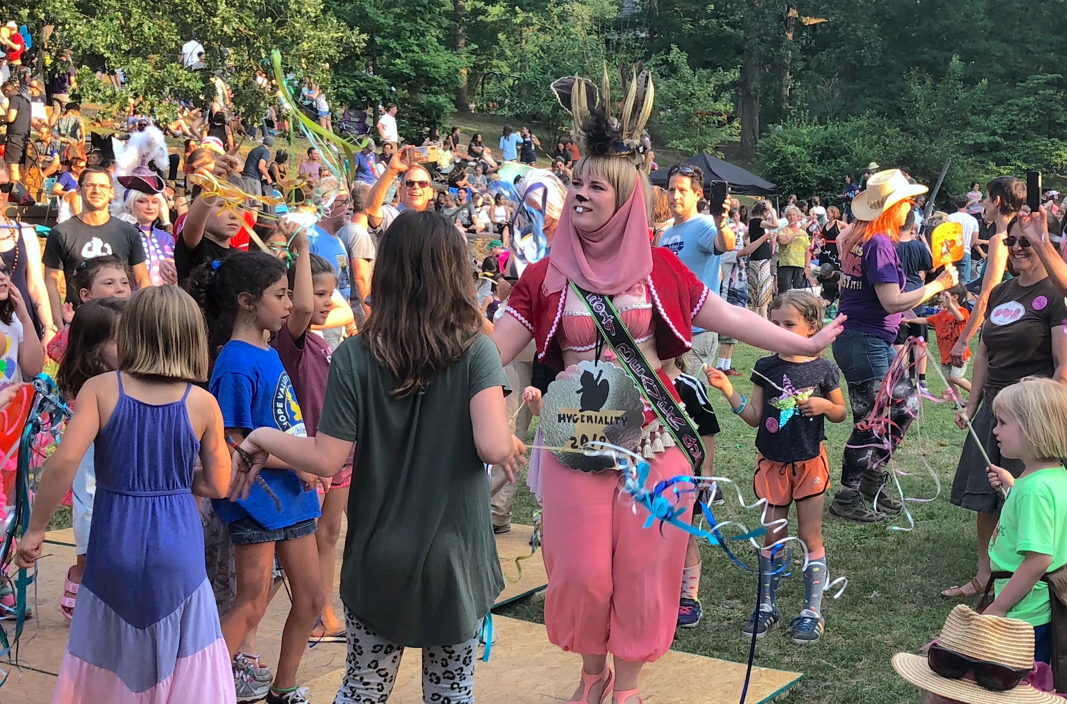 A beaver genie poses among a crowd